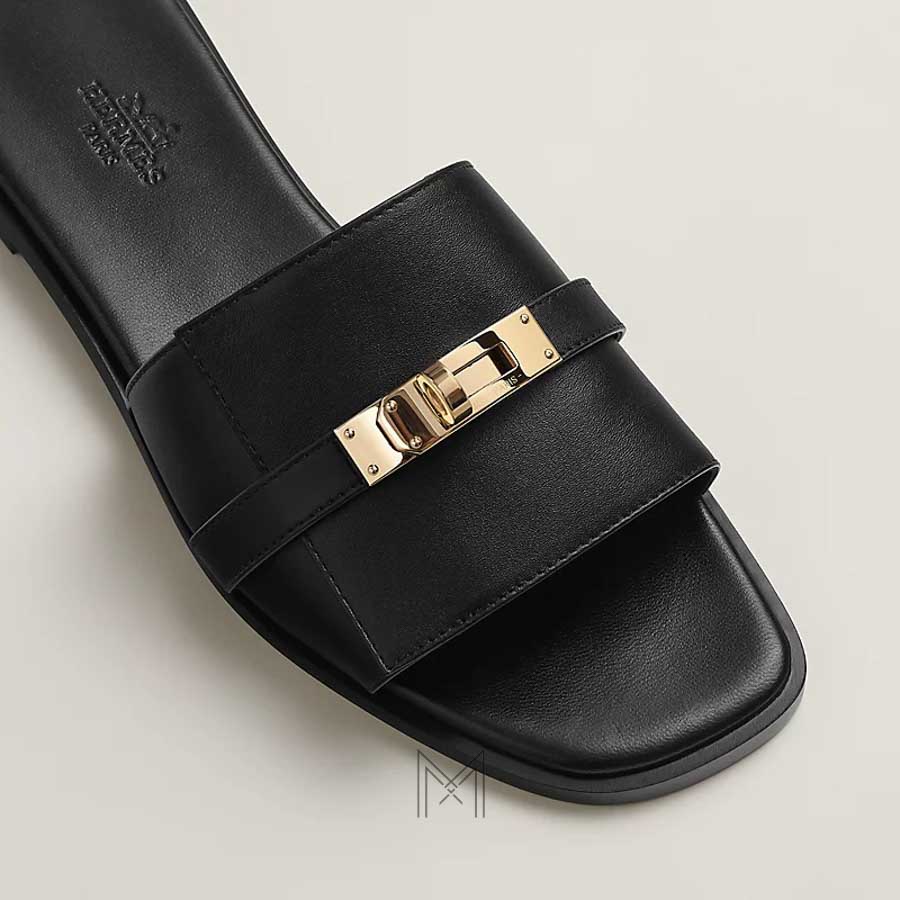 Dép Hermes Giulia quai ngang chính hãng màu đen mặt khoá vàng MHHH034 2026 Dép Hermes Giulia quai ngang chính hãng màu đen mặt khoá vàng MHHH034 2026