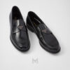 Giày loafer Prada màu đen logo bạc chính hãng NGP001 2026 Giày loafer Prada màu đen logo bạc chính hãng NGP001 2026