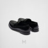 Giày loafer Prada màu đen logo bạc chính hãng NGP001 2026 Giày loafer Prada màu đen logo bạc chính hãng NGP001 2026
