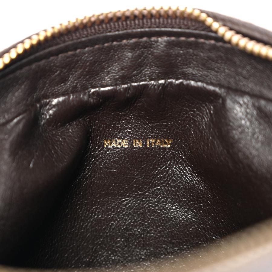 Túi Chanel chuông màu nâu da cừu hoạ tiết chữ V chần bông chính hãng TCN33 2026 Túi Chanel chuông màu nâu da cừu hoạ tiết chữ V chần bông chính hãng TCN33 2026